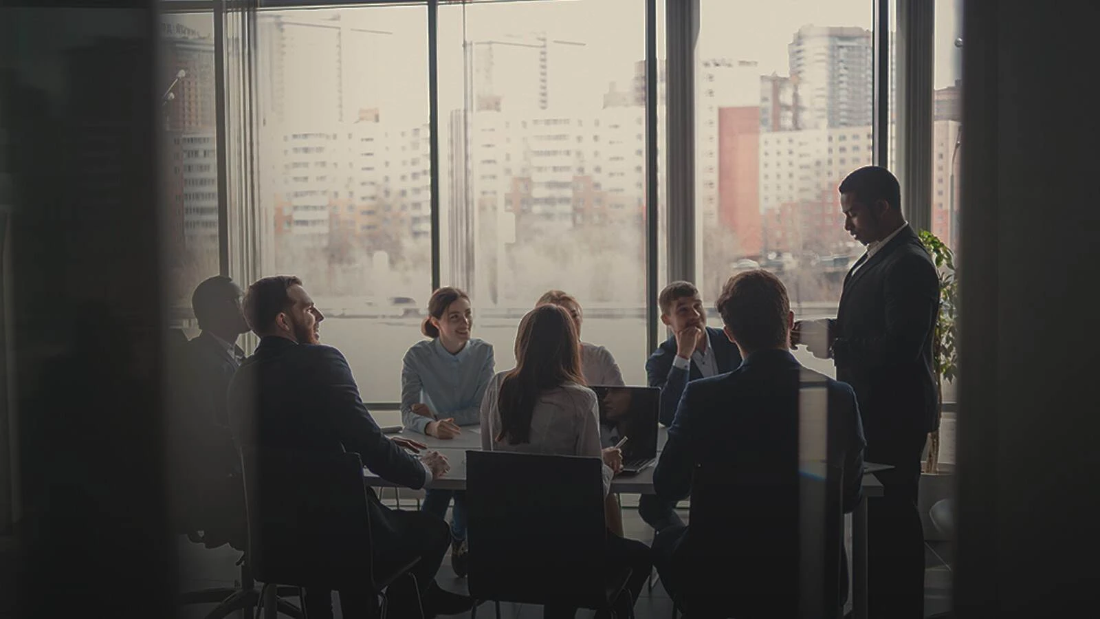 People in conference room in discussion