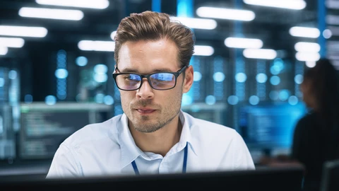 Man in front of monitor focusing on issue at hand